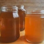 three jars without lids on a wood surface