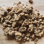granola clusters on a wooden surface
