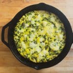 vegetable frittata in a cast iron skillet on a wooden table