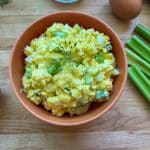 close up of best egg salad with a sprig of dill on top