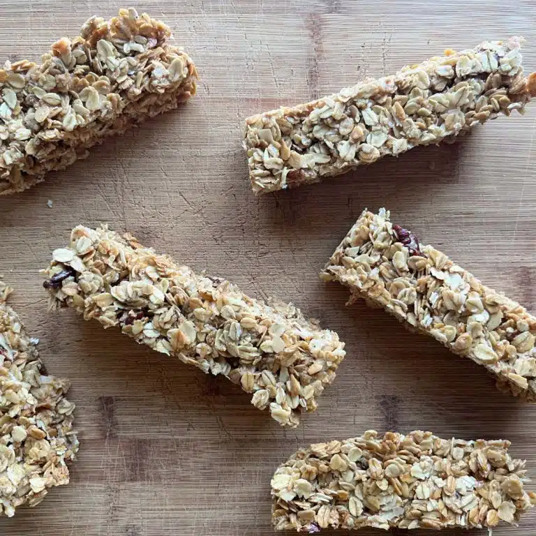 six chewy granola bars on a cutting board