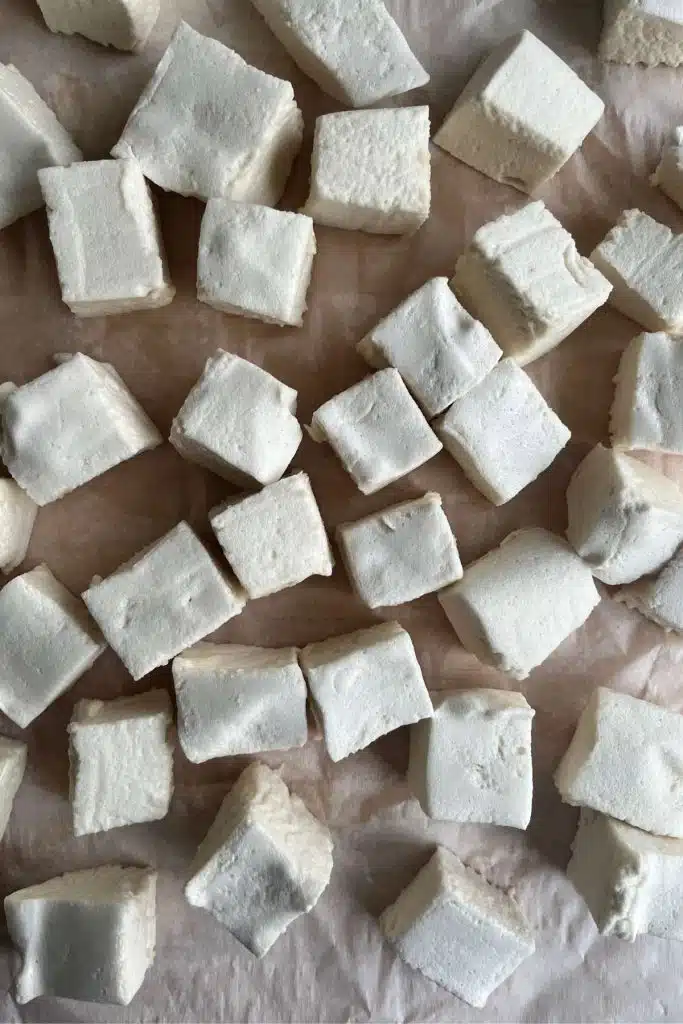 homemade marshmallows on a sheet of parchment paper