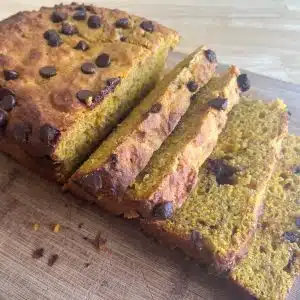 sourdough pumpkin bread on a wood cutting board